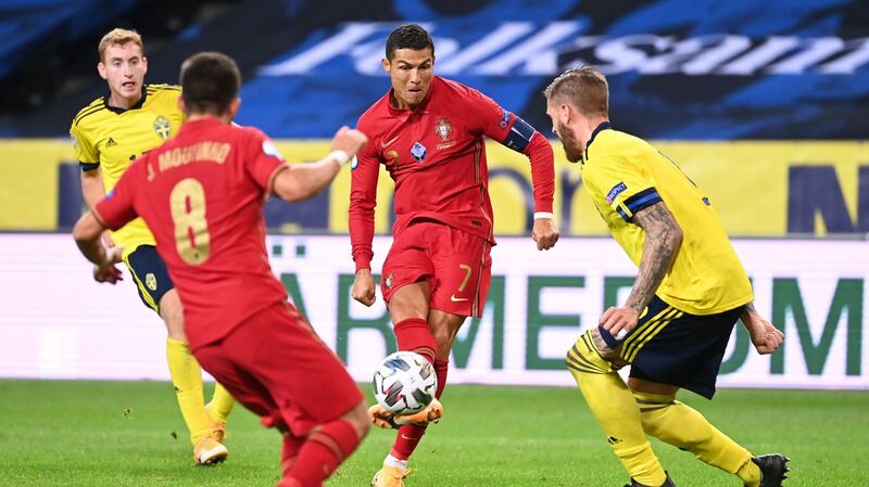 Cristiano Ronaldo scores his second goal against Sweden. Photograph: Jonathan Nackstrand/Getty/AFP