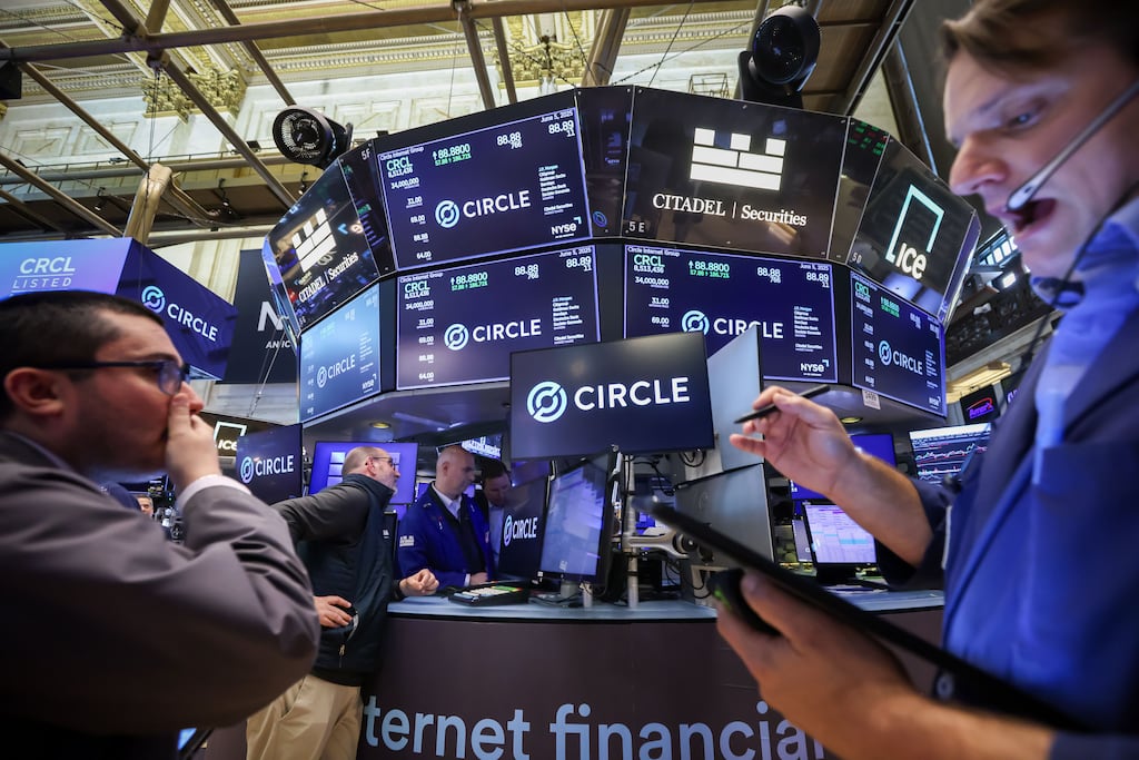 Traders work on the floor of the New York Stock Exchange. Global stocks held steady on Tuesday as trade talks between the United States and China continued into a second day, giving investors some reason to believe tensions between the world’s two largest economies may be easing. Photograph: Michael Nagle/Bloomberg