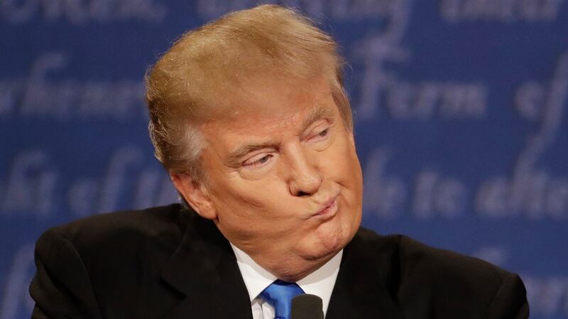 Republican presidential nominee Donald Trump listens to Democratic presidential nominee Hillary Clinton during the presidential debate at Hofstra University in Hempstead on Monday. Photograph: AP