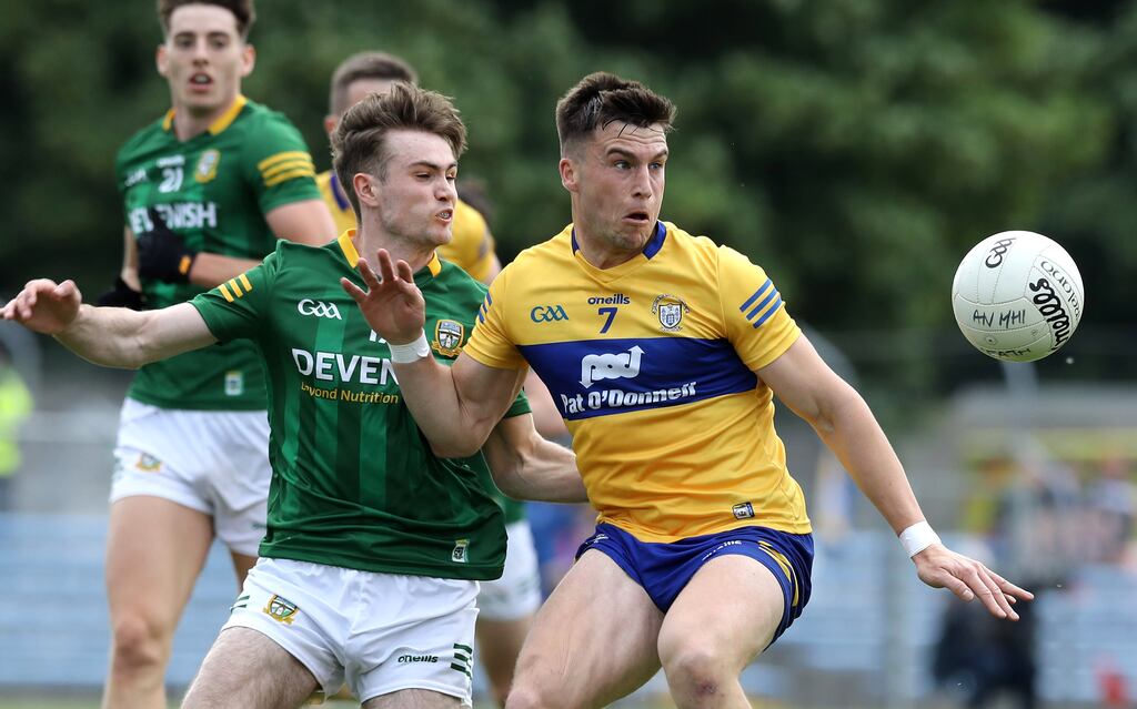 Meath's Cathal Hickey competes with Clare's Jamie Malone during the All-Ireland SFC firt-round qualifier at Cusack Park in Ennis. Photograph: Lorraine O’Sullivan/Inpho