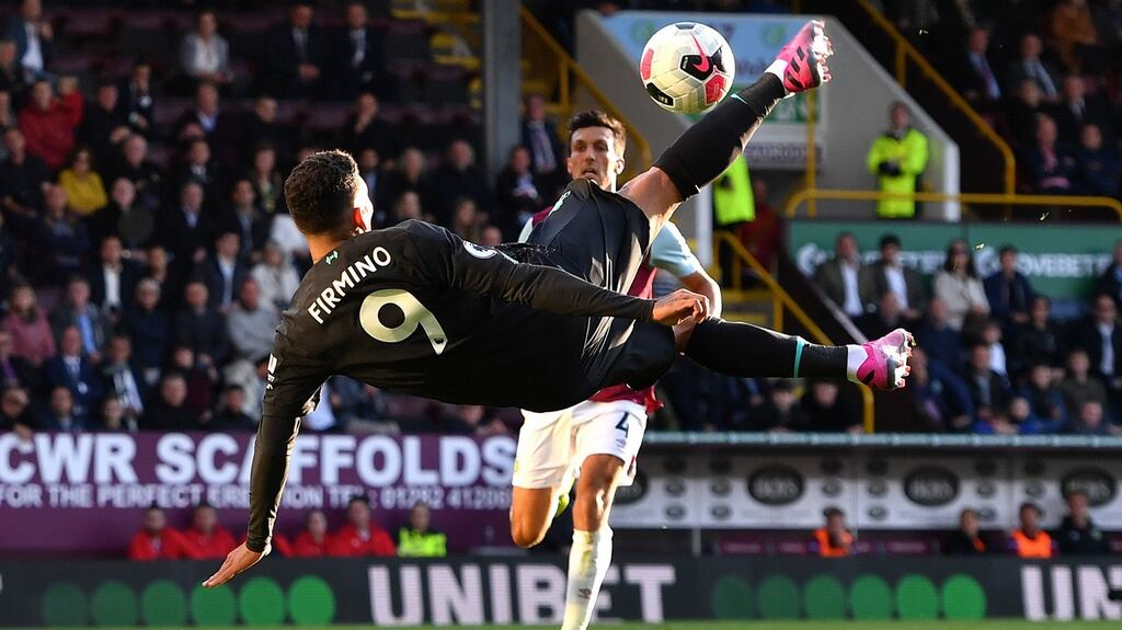 Roberto Firmino attempts an overhead kick.
