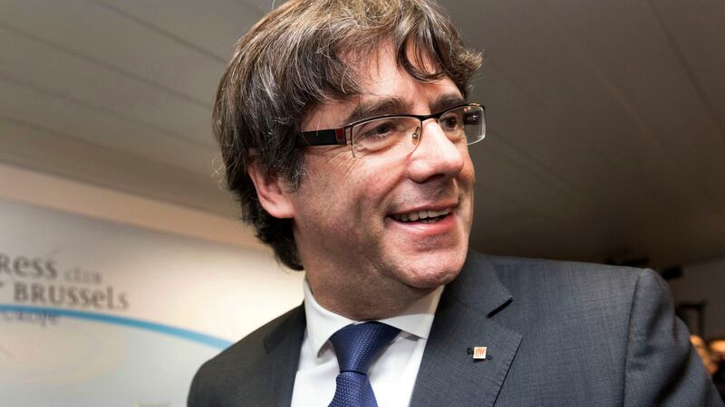 Sacked Catalan president Carles Puigdemont at a press conference in Brussels on Tuesday. Photograph: Olivier Matthys/AP Photo
