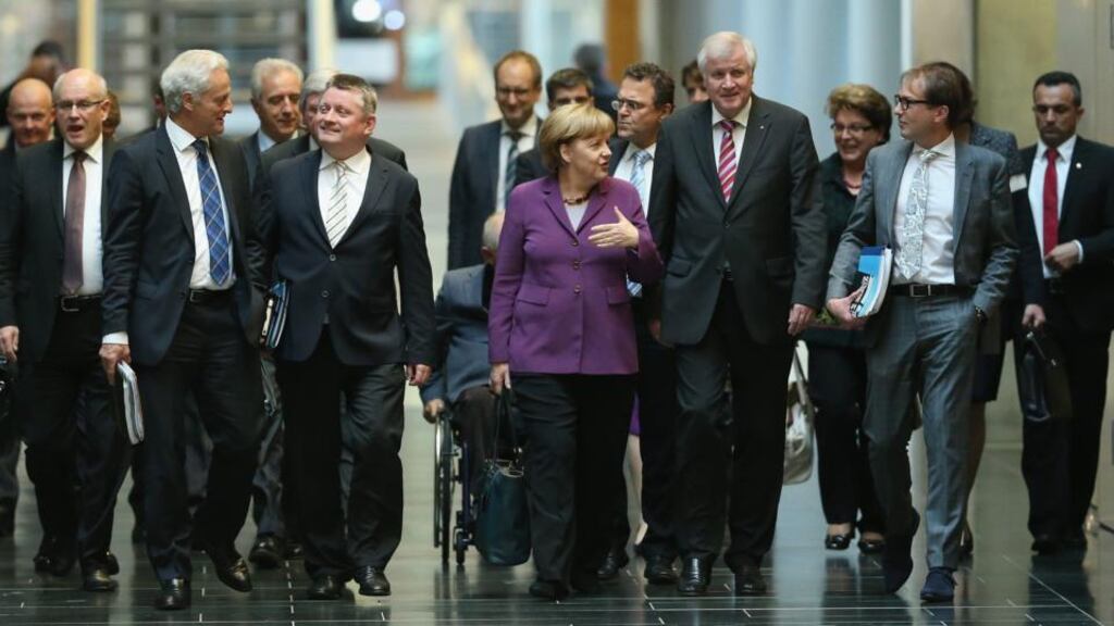 Leading members of the German Christian Democrats (CDU), including Chancellor Angela Merkel andHorst Seehofer (right of Merkel), chairman of the bavrian Christian Democrats (CSU), arrive for talks over a possible government coalition with the German Greens Party yesterday in Berlin. Photograph: Sean Gallup/Getty Images.