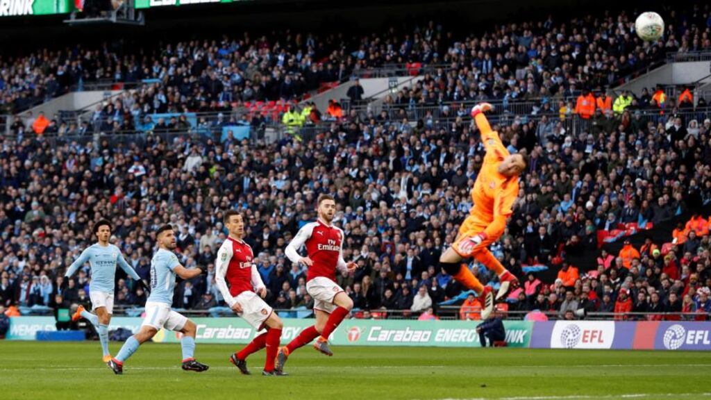 Sergio Aguero lobs David Ospina to put Manchester City 1-0 up during the Carabao Cup win over Arsenal at Wembley. Photo: Getty Images