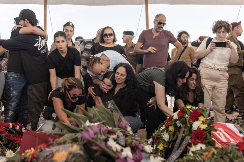Mourners at the funeral of a family murdered by Hamas in their home during the October 7th attack. Photograph: Avishag Shaar-Yashuv/The New York Times