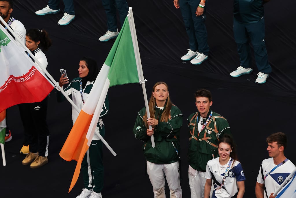 Ireland’s Mona McSharry and Fintan McCarthy with the Tricolour during the closing ceremon yof the 2024 Olympic Games in Paris. Photograph: Ryan Byrne/Inpho