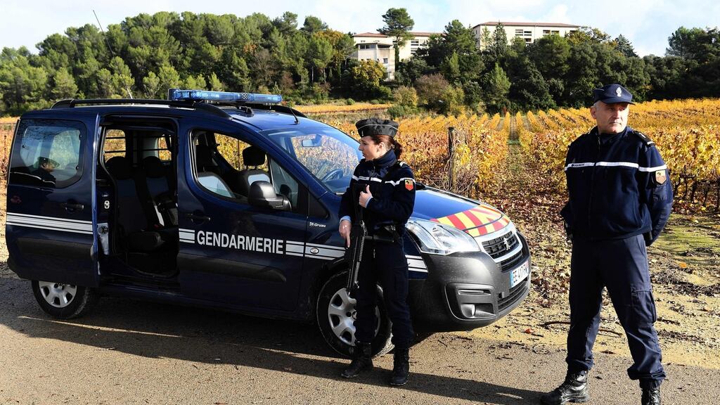 French police stand guard on a road near a retirement home for missionaries in Montferrier-sur-Lez, southern France. Photograph: Pascal Guyot/AFP/Getty Images