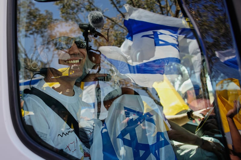 Israeli hostage Omri Miran, left, was welcomed home at Kibbutz Kramim. Photograph: AP