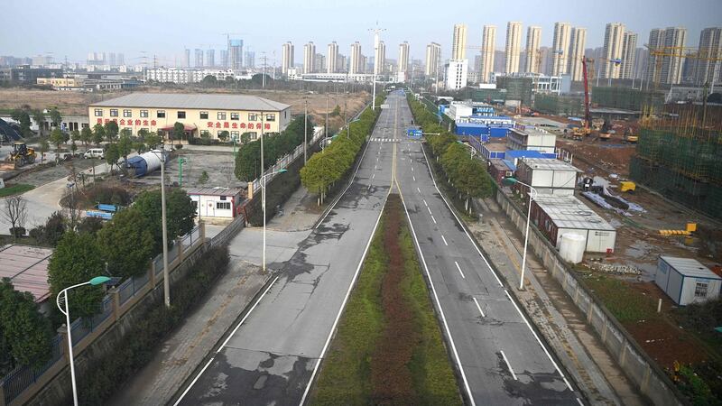 An empty street  in Wuhan, China. Photograph: Noel Celis/AFP via Getty Images