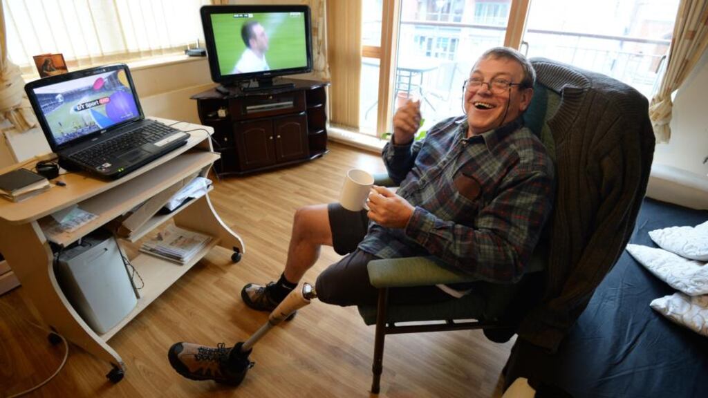 Robert White in his Sophia Housing Association apartment: ‘I put a runner on my foot and said: cheaper than Dunnes, half price!’ Photograph: Alan Betson