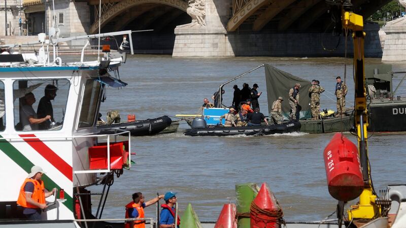 Recovery workers on a barge on the Danube river, where a sightseeing boat capsized and sank, in Budapest, Hungary, on Saturday, June 1st. Photograph: Laszlo Balogh/AP Photo