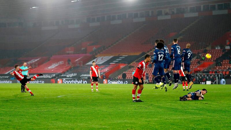 Hector Bellerin lies down behind the wall as James Ward-Prowse takes a free-kick for Southampton. Photograph: Frank Augstein/Getty/AFP