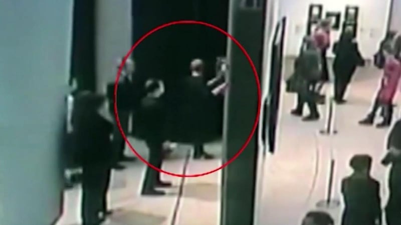 A still from a video showing the suspect stealing ‘Ai-Petri. Crimea’ by Russian landscape painter Arkhip Kuindzhi in Zarechye, Moscow. Photograph: EPA/Russian Internal Affairs Ministry