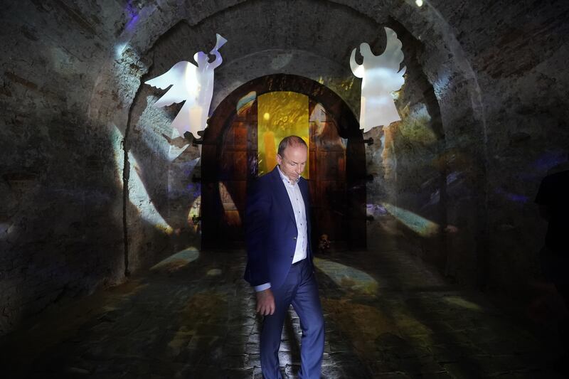 Taoiseach Micheál Martin views the memorial to children killed during the Russian invasion at the Crucified Ukraine Exhibition at the National Museum of the History of Ukraine. Photograph: PA Images