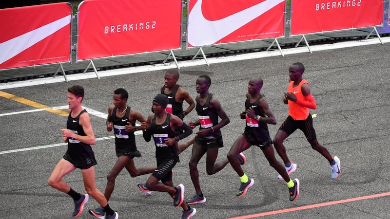 Runners take up formation with Kipochge at the back in red. Photo: Pier Marco Tacca/Getty Images
