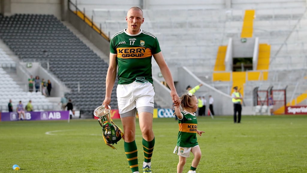 Kerry’s Kieran Donaghy with his daughter Lola Rose after the Munster final. Photograph: Ryan Byrne/Inpho