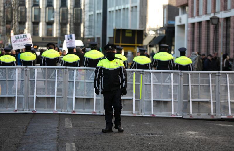 Gardaí on Molesworth Street after street protests in Dublin: Where retiring members used to get their entire pension when departing at, say, 55, they now have to wait until 66 to get the State pension element.
Photograph: Gareth Chaney/Collins