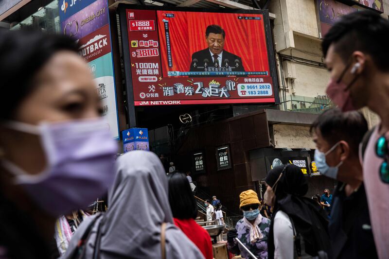 Chinese president Xi Jinping is seen on a TV in a street in Hong Kong on Sunday. Photograph: Isaac Lawrence/AFP/Getty