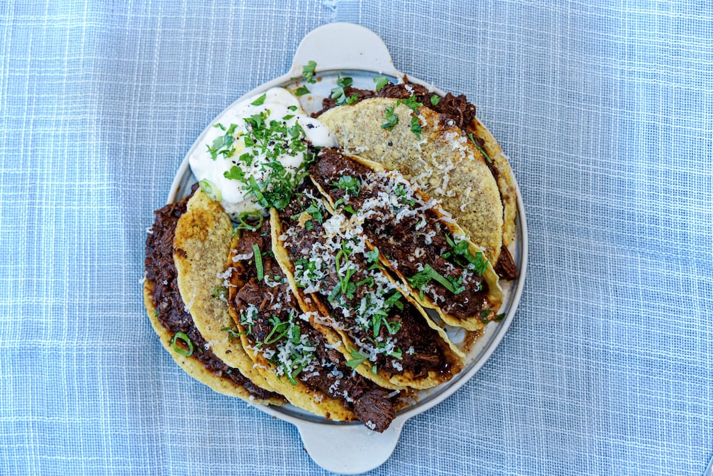 Corned beef tacos with a zingy parsley sauce. Photograph: Harry Weir Photography