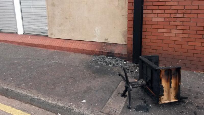Charred equipment outside a beauty salon owned by a Polish woman that was set on fire in the latest of a spate of attacks on foreign nationals in Belfast. Photograph: PA