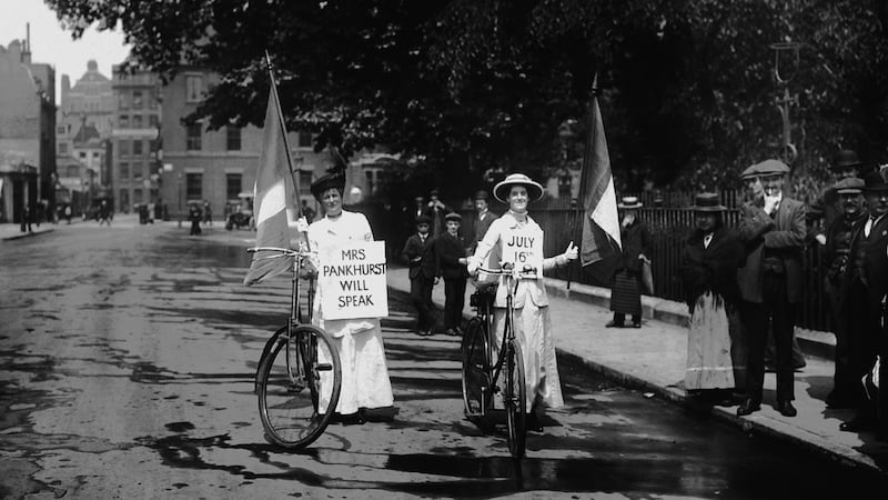 Members of the suffragette movement on their bicycles in July 1914 carrying signs advertising a meeting where militant campaigner Emmeline Pankhurst will speak. Photograph: Hulton-Deutsch Collection/Corbis via Getty Images