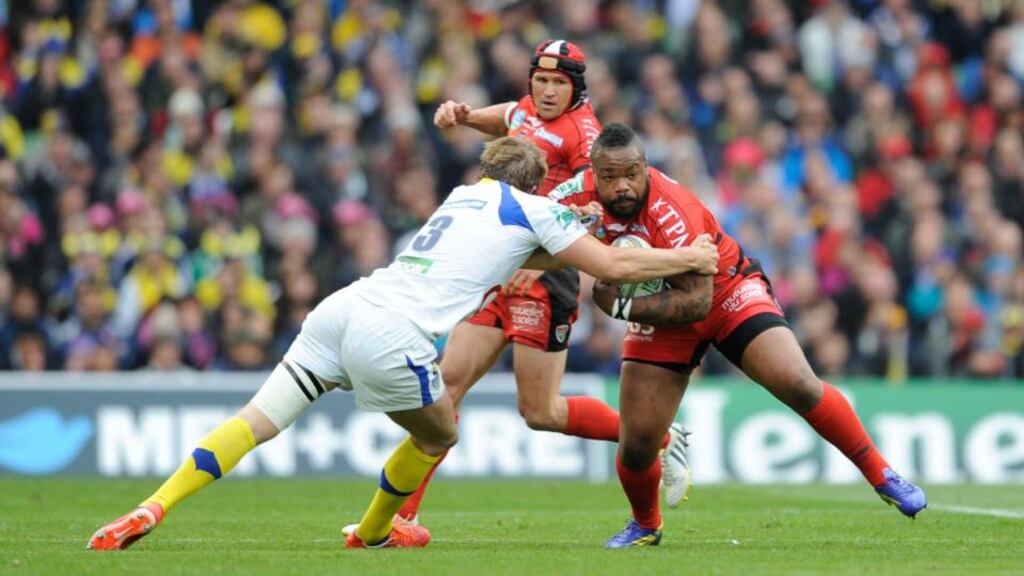 Mathieu Bastareaud of RC Toulon is tackled by Aurelien Rougerie of ASM Clermont Auvergne during the Heineken Cup Final between ASM Clermont Auvergne and RC Toulon at the Aviva Stadium, Dublin. Photo: Rob Munro