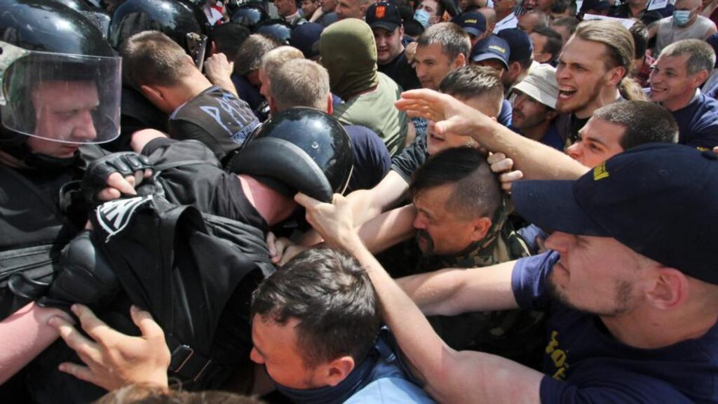 Riot police attempt to prevent supporters of the Ukrainian opposition from attacking supporters of President Viktor Yanukovich and the pro-presidential Party of the Regions during a rally in Kiev on Saturday. Photograph: Alexander Perevoznik/Reuters