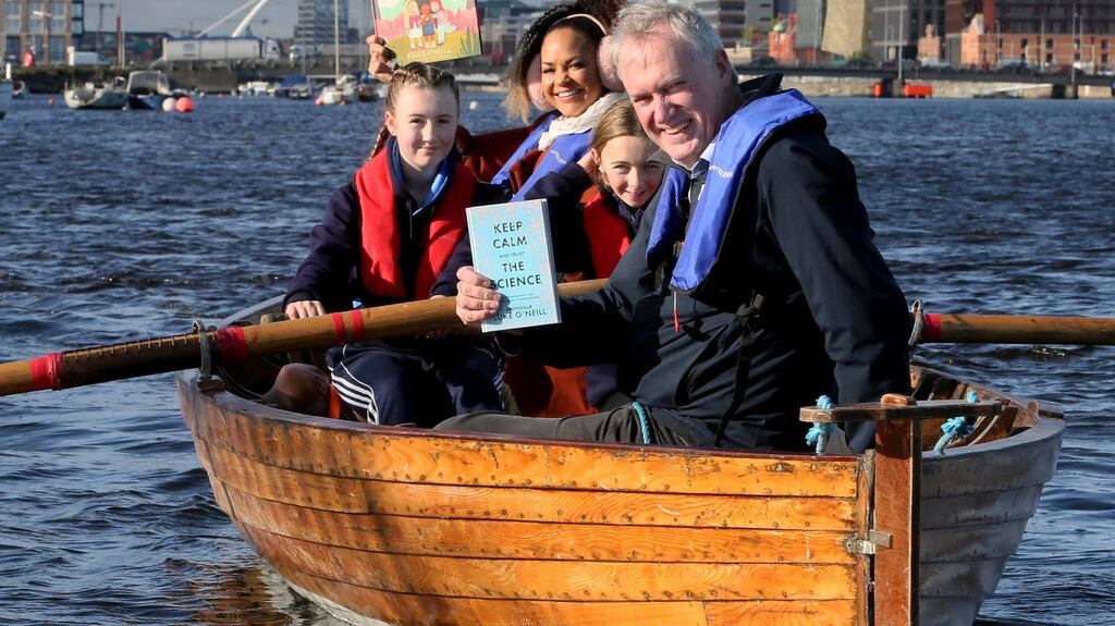 Authors Luke O’Neill and Emer O’Neill heading off on a literary adventure with help from Thea Horan, left, and Ella Byrne from the Stella Maris rowing club marking the launch of Dublin Book Festival 2021. Photograpgh: Mark Stedman