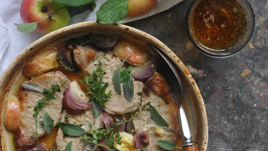 The pork chops are cooked in a little cider with wedges of apple and onion and plenty of herbs.