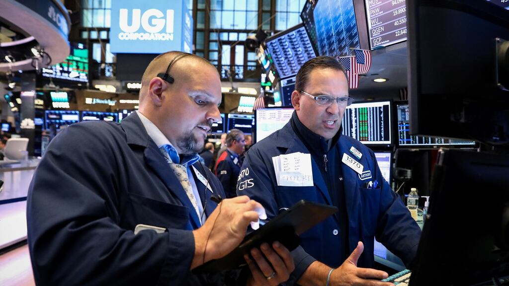 Traders work on the floor at the New York Stock Exchange. Photograph: REUTERS/Brendan McDermid