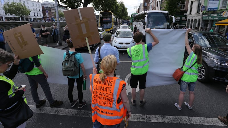 Activists from the Extinction Rebellion environmental action group block traffic on Bachelors Walk. The EPA said NO2 levels in the capital are exceeding EU guidelines. Photograph: Crispin Rodwell for the Irish Times