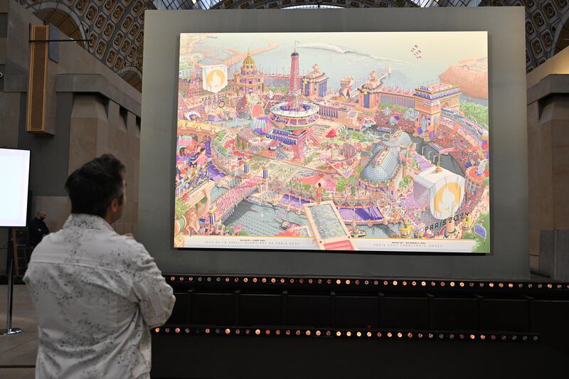 French artist Ugo Gattoni looks at the official posters of the Paris 2024 Olympic and Paralympic Games he made at Orsay Museum in Paris. Photograpg: Mustafa Yalcin/Anadolu via Getty Images