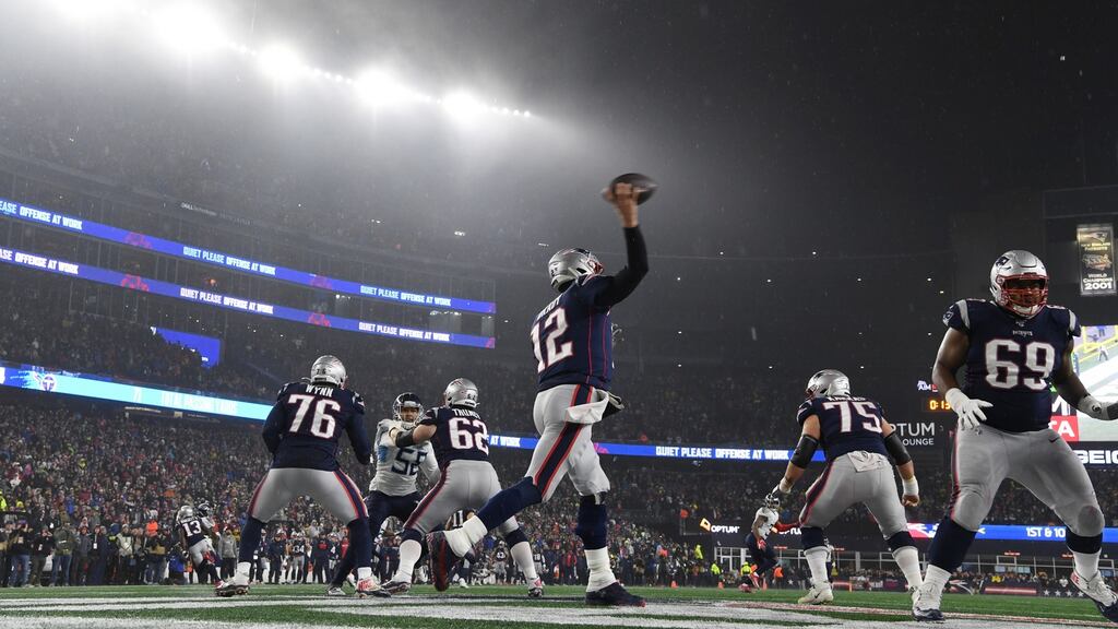 New England Patriots quarterback Tom Brady throws an interception to the Tennessee Titans for a touchdown in the final seconds of their AFC wildcard playoff game at Gillette Stadium in Foxborough, Massachusetts. Photograph: John Cetrino/EPA