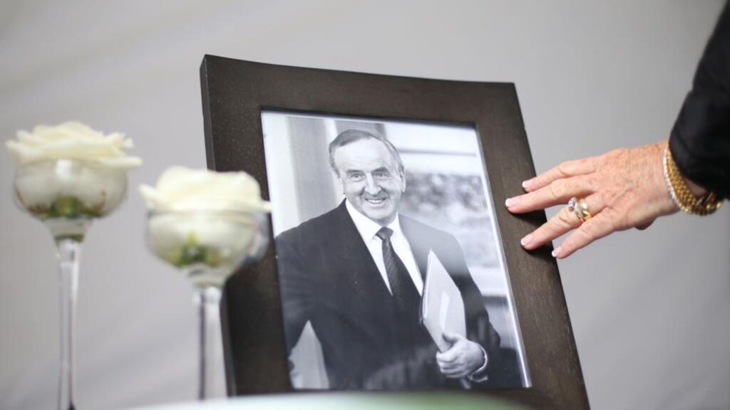 A member of the public pays their final respects to former taoiseach Albert Reynolds as his body lies in state in the Oak Room at the Mansion House, Dublin, before his funeral on Monday. Photograph: Brian Lawless/PA Wire