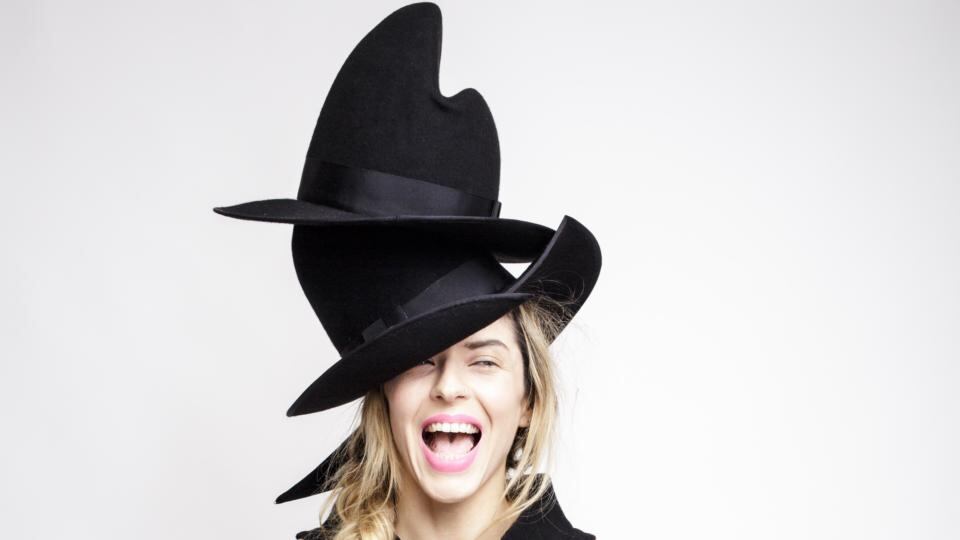 Two hats: Breuer, a black wool felt wide-brim sculptural hat (£290/€350) and Gropius, a black wool felt hat with an asymmetric brim (£325/€390), by Marie Claire Ferguson