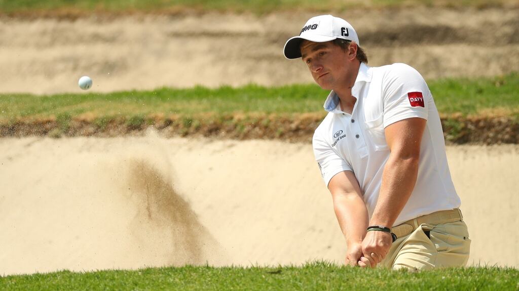 Paul Dunne of Ireland plays out of a bunker onto the first green during the second round of World Golf Championships-Mexico Championship at Club de Golf Chapultepec in Mexico City, Mexico. Photo: Gregory Shamus/Getty Images
