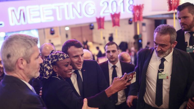 French president Emmanuel Macron poses for a selfie with an attendee in Davos, Switzerland. Photograph: Simon Dawson/Bloomberg