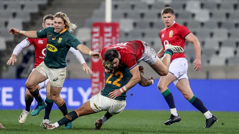 Robbie Henshaw is tackled by Elton Jantjies. Photograph: Dan Sheridan/Inpho