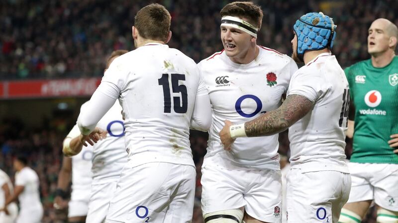 Tom Curry and Jack Nowell celebrate with Elliot Daly after the fullback’s try. Photograph: Billy Stickland/Inpho