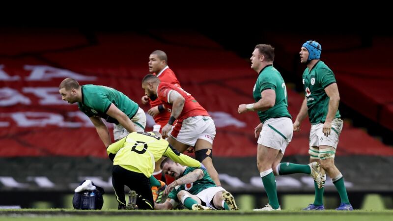 Ireland’s Johnny Sexton gets treatment on the pitch. Photograph: Laszlo Geczo/Inpho