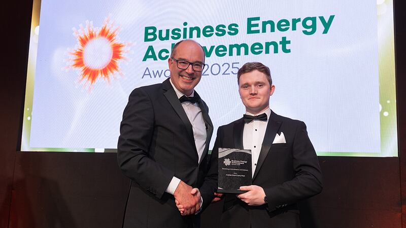 Xavier Dubuisson, awards judge, presents the best energy achievement in life sciences to Daniel Walsh, Astellas Ireland Kerry Plant
