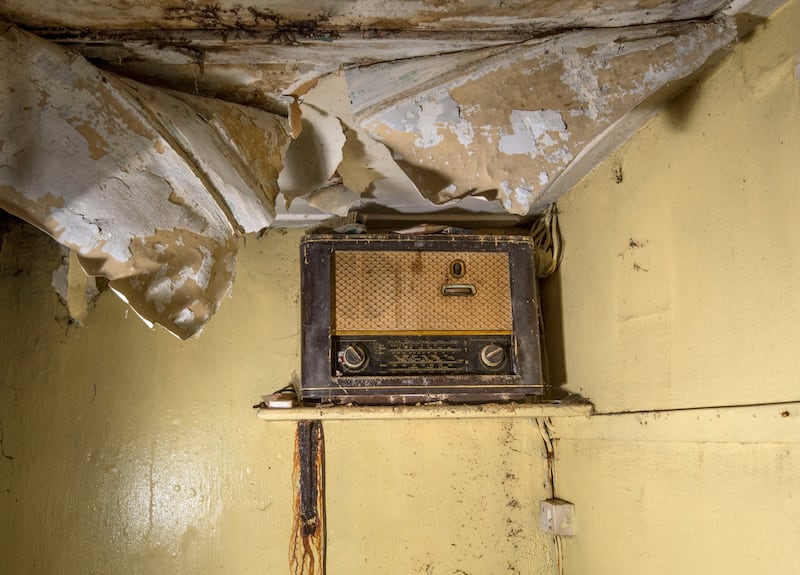 A radio sits on a shelf in the dilapidated Laurels cottage in Glenties, the original home of the five Mundy sisters where Friel played as a child. Locals are raisings funds to restore the cottage. Photograph: Brenda Fitzsimons
