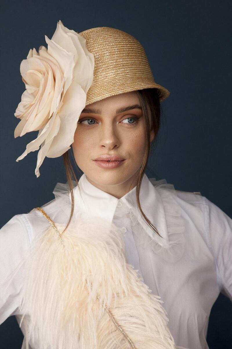 Small straw cloche with silk flower by Anthony Peto €420. Photograph: Daniel Holfeld