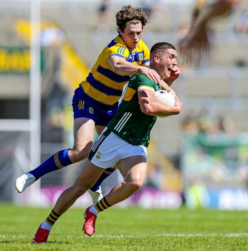 Kerry's Joe O’Connor is challenged by Keith Doyle of Roscommon during the game in Killarney. Photograph: Laszlo Geczo/Inpho