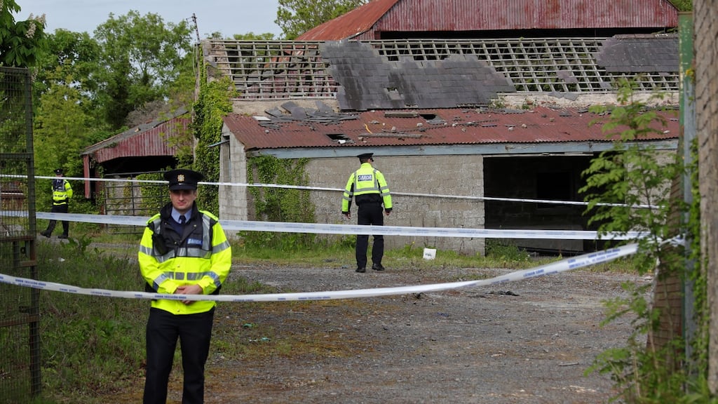 Gardaí continue their investigations at the derelict house and farmyard on the Clonee Road, Lucan, where the body of 14 year old Ana Kriegal was found on Thursday. Photograph: Collins Dublin