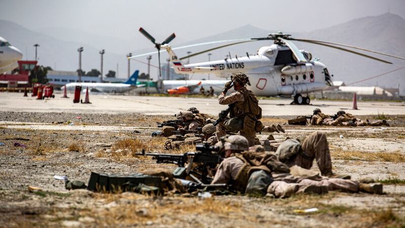 A handout image from the  US Marine Corps shows marines providing security at Hamid Karzai International Airport in Kabul, Afghanistan. Photograph: AP