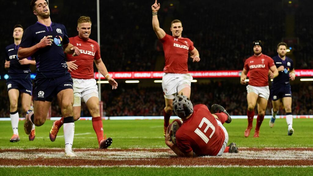 Jonathan Davies scores Wales’ second try against Scotland. Photograph: Rebecca Naden/Reuters