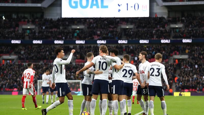 Tottenham celebrate after Ryan Shawcross’s own goal gave them the lead at Wembley. Photograph: Catherine Ivill/Getty