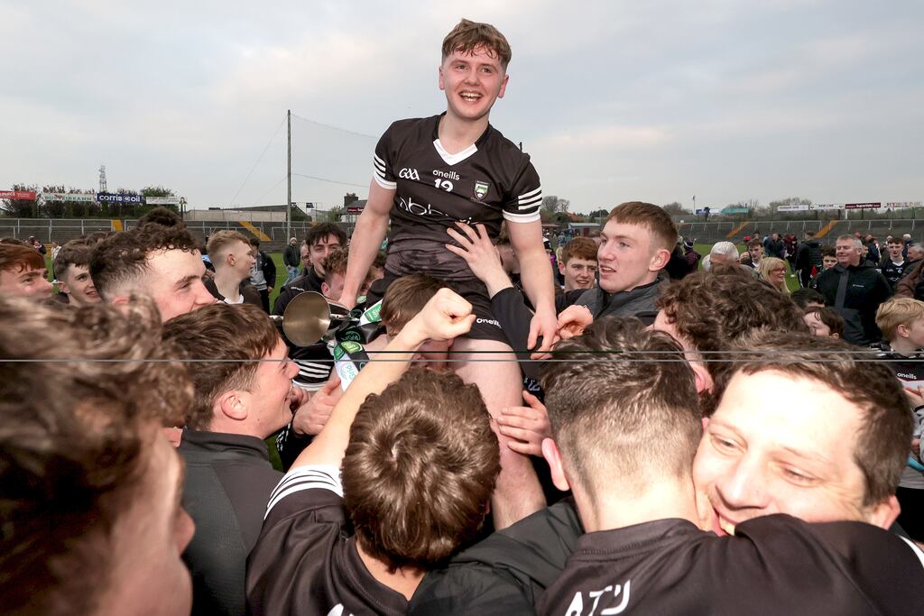 Dillon Walsh celebrates with the trophy after Sligo's win over Galway in the Connacht under-20 football final at Tuam Stadium. Photograph: Laszlo Geczo/Inpho