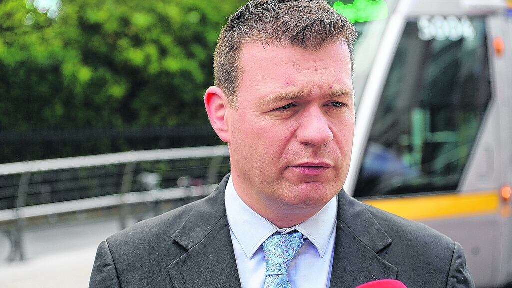 Alan Kelly visited soccer clubs and a barber shop in Tipperary with John Delaney. Photograph: Cyril Byrne